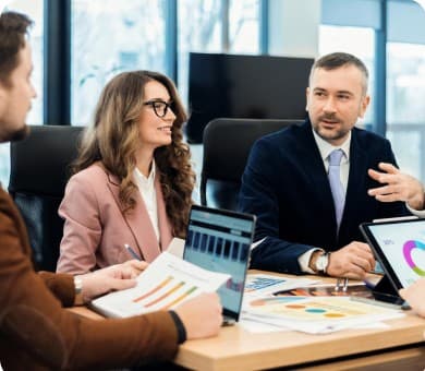 Team reviewing reports in a meeting
